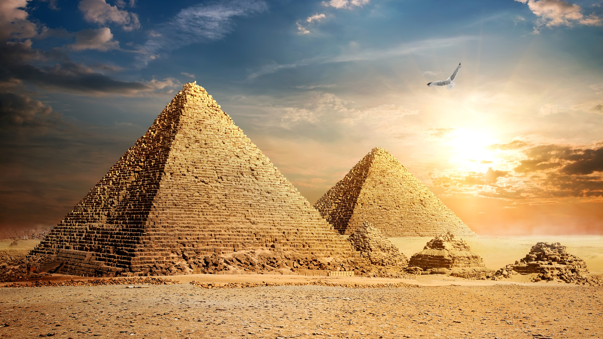 Download Pyramids, Egypt, Clouds, Sky, Sun, Bird, Desert, Stones Wallpaper  in 1920x1080 Resolution