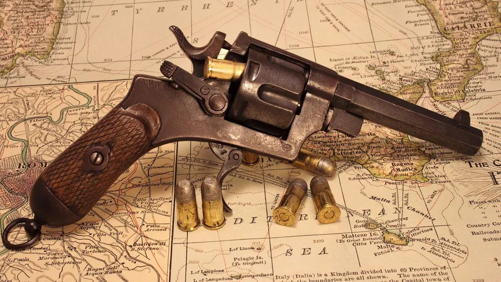 Обои Revolver and Map 240x400